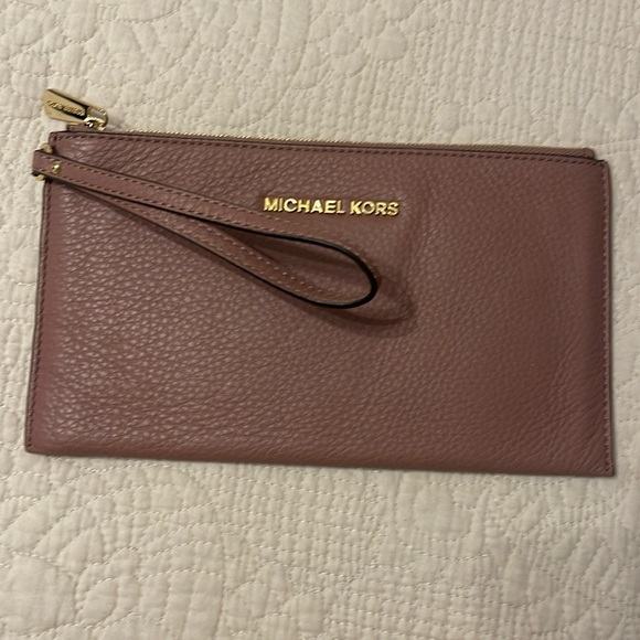 Brand new Michael Kors wristlet color mauve with gold trim. - Picture 1 of 1